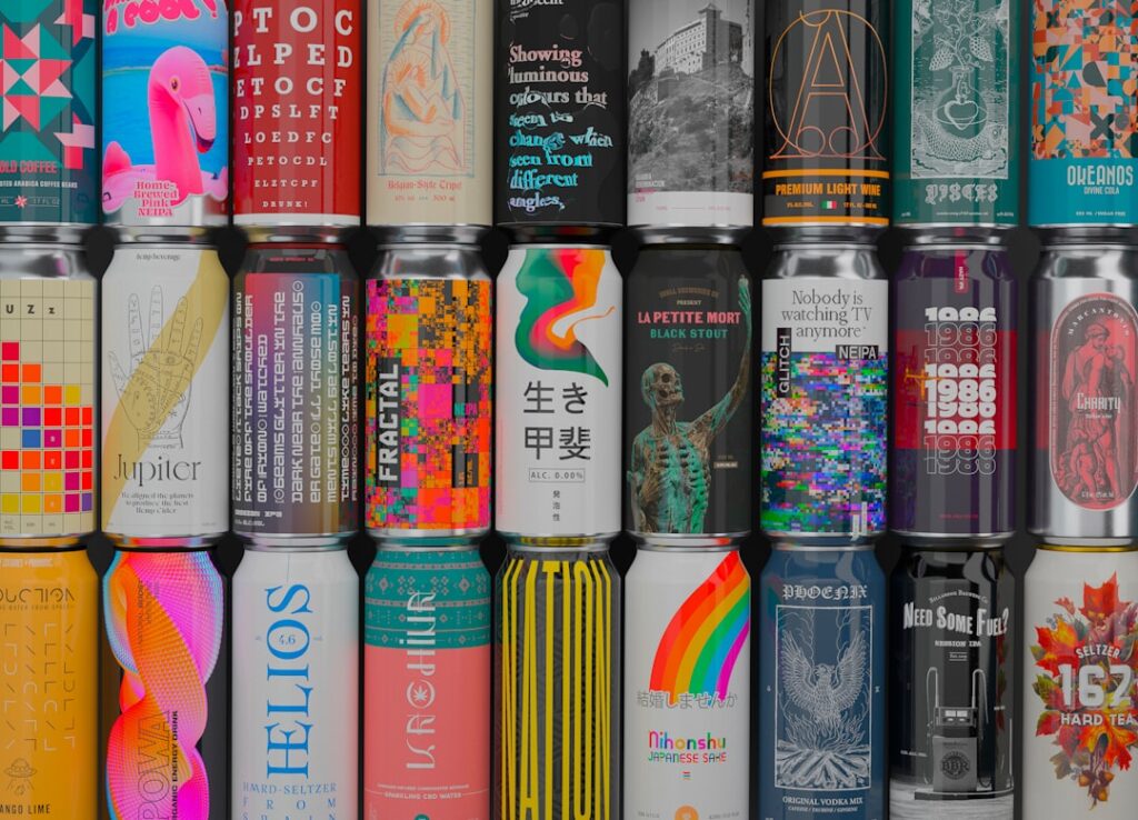 A person examines a beer can showing style, alcohol content, ingredients, and date markings.